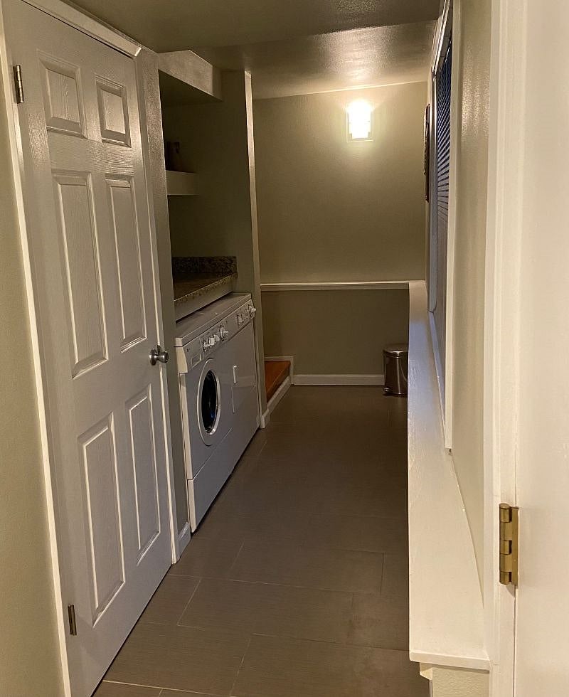 Separate laundry area in the main house. Door on the right enters the backyard where guest house is located.