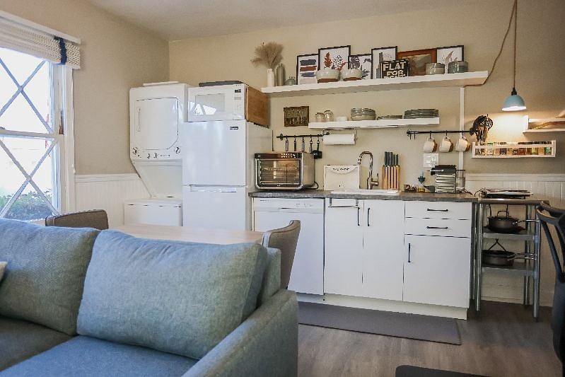 Washer and dryer, apartment-size fridge, air fryer and induction hot plate. Everything you need to cook meals. 