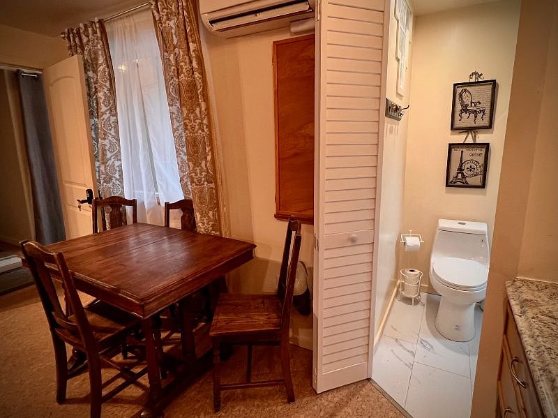 Grandmere's table and chairs for dining and the entrance to the bath.