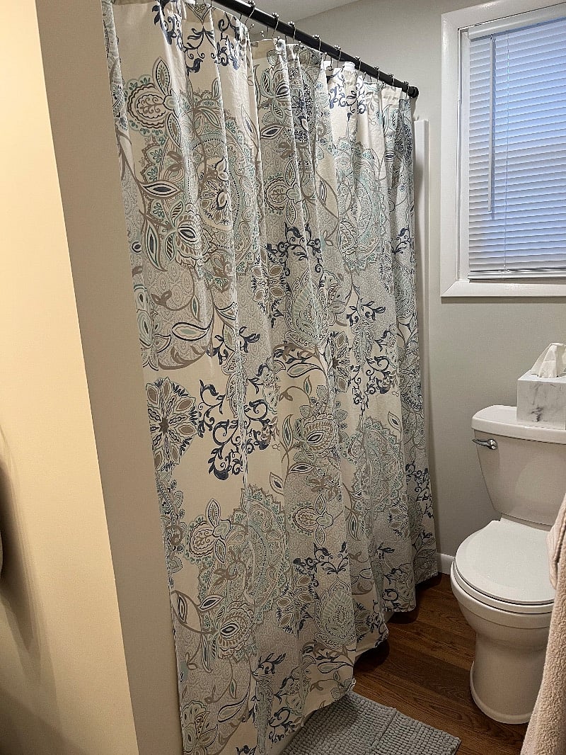 Fresh bathroom with new everything... shower/tub combo, cabinetry, toilet, towels, oh my!