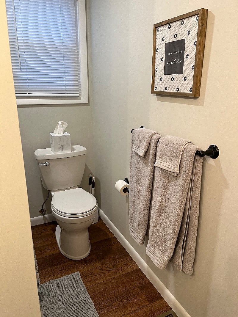 Fresh bathroom with new everything... shower/tub combo, cabinetry, toilet, towels, oh my!