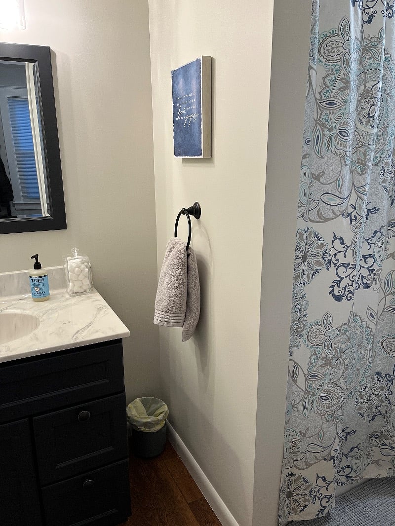 Fresh bathroom with new everything... shower/tub combo, cabinetry, toilet, towels, oh my!