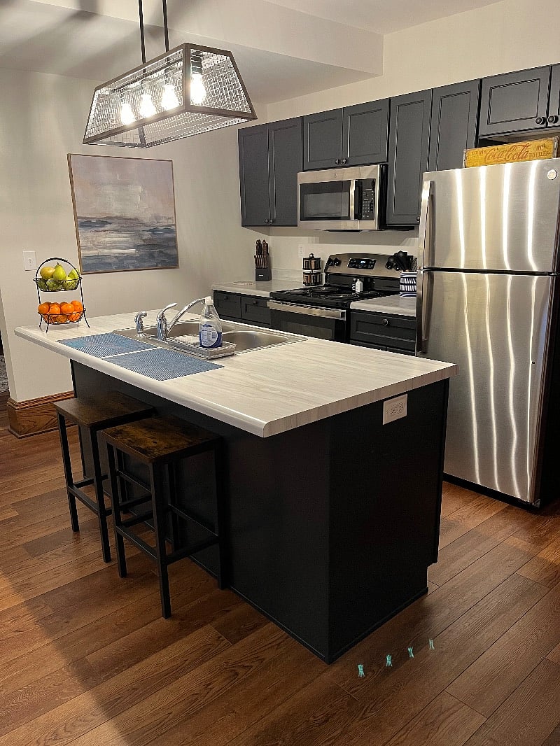 Beautiful kitchen with range, refrigerator, dishwasher, microwave, coffee station, eat-in spots and much more!