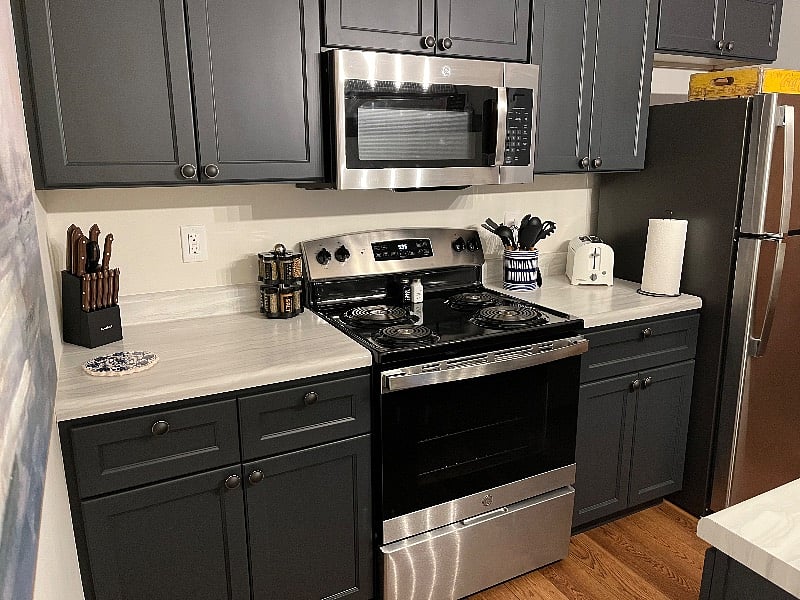 Beautiful kitchen with range, refrigerator, dishwasher, microwave, coffee station, eat-in spots and much more!