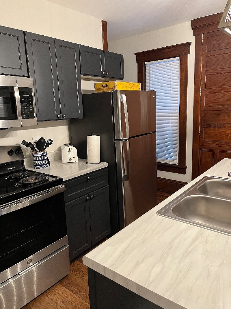 Beautiful kitchen with range, refrigerator, dishwasher, microwave, coffee station, eat-in spots and much more!