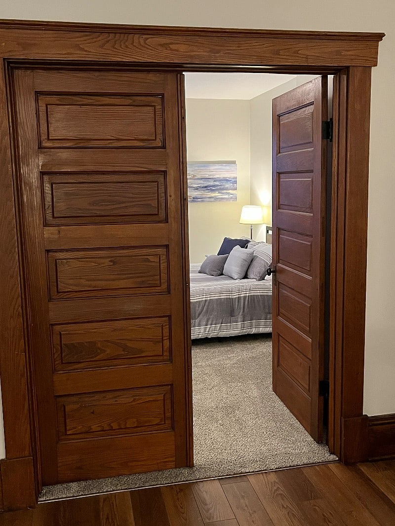Front bedroom doors 1/2 closed. You can lock it into place if you prefer.