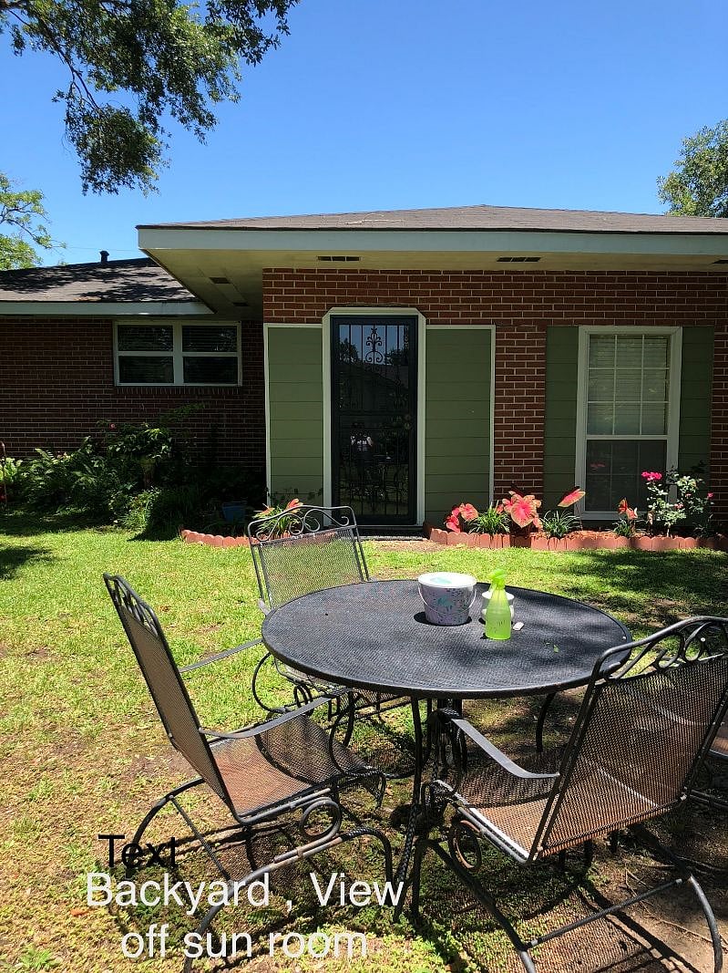 Back Yard looking at Sunroom Door
