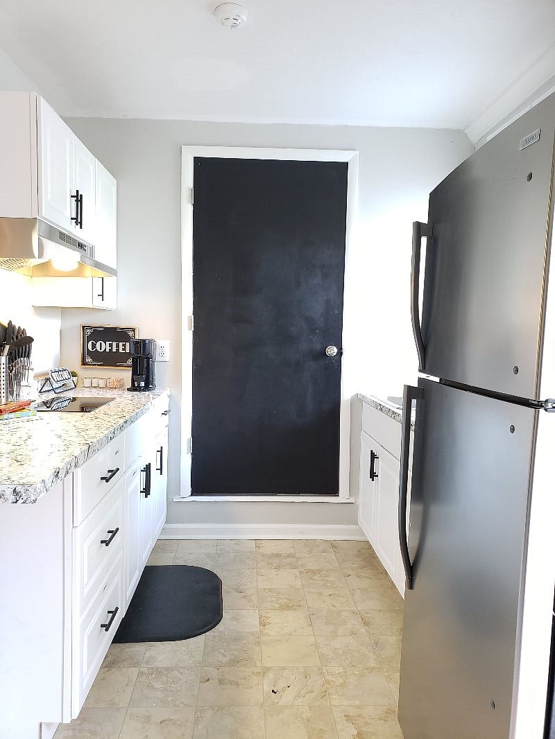 galley kitchen with full fridge and 2 burner cook-top.