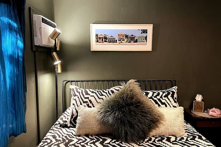 Layered light both natural and lamp-sourced. The adjustable bedside floor lamp mood lights the whole room or focuses spotlights for reading. Double-layered, dark curtain sheers allow you to play with light from the garden while maintaining privacy.