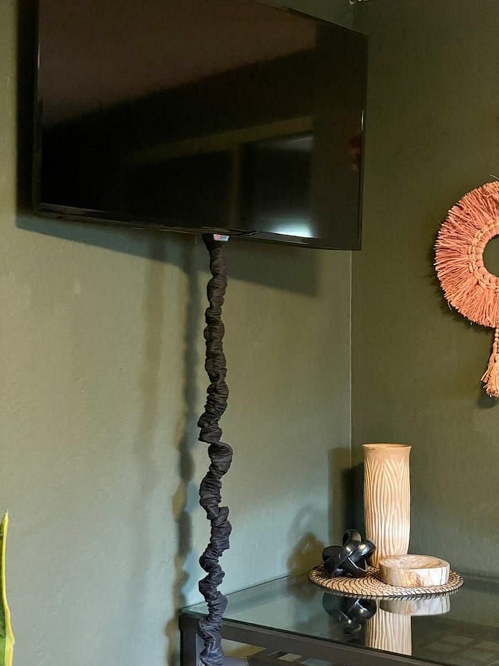 39 smart Fire TV mounted above your desk, tilts, extends and rotates for views from everywhere in your bedroom.