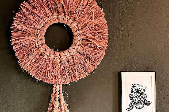 More original art and antiques from the host's collection for your enjoyment a Tibetan dancing mask, African raffia ring and a paper-cut owl.