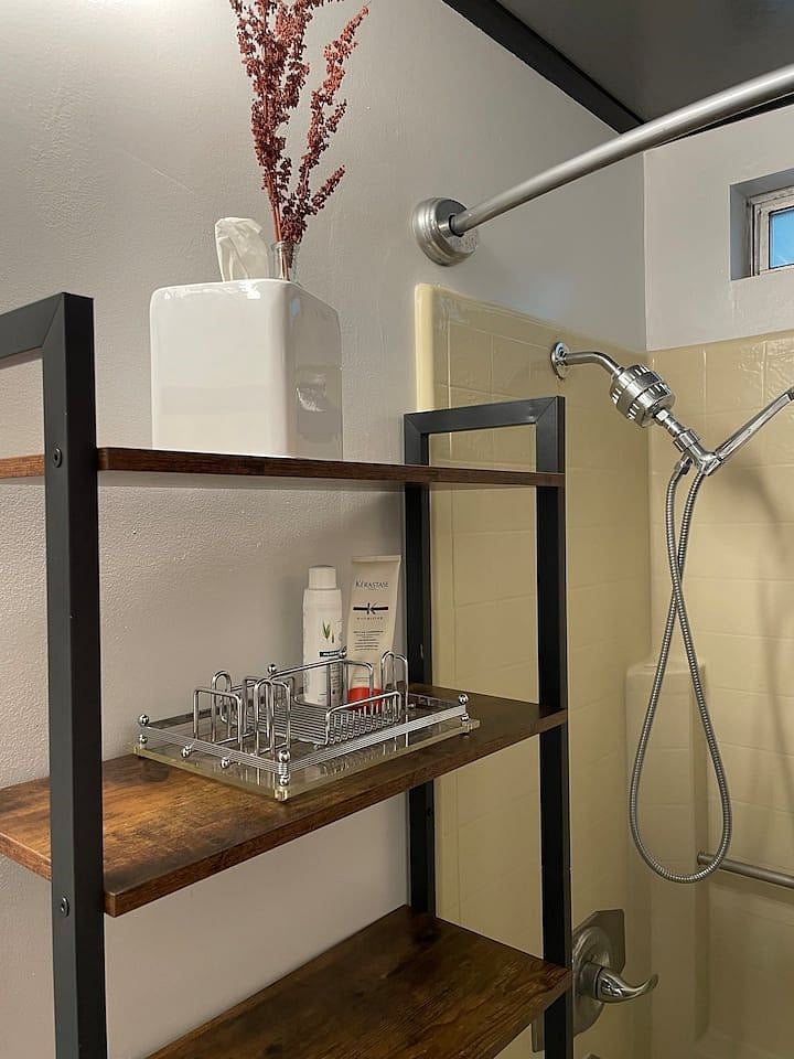Shower head fitted with a water purifier to keep you hair soft.