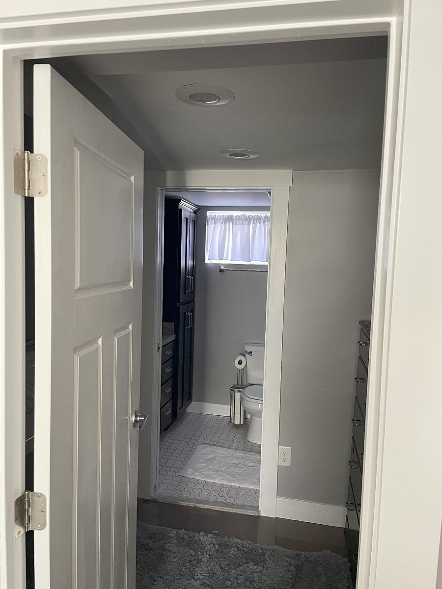 View from bedroom into closet and bathroom