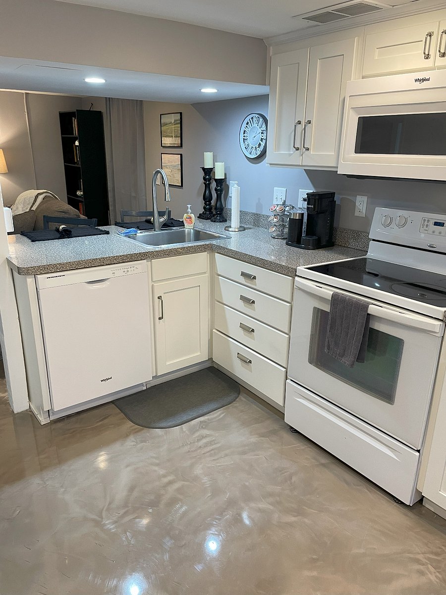 Floors throughout unit recently updated to epoxy and comfy rugs.