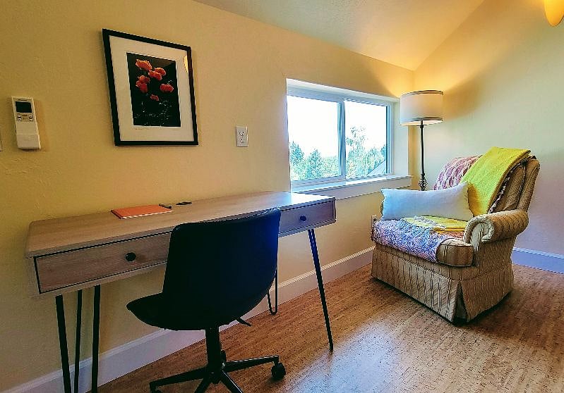 Home office station and reading nook with views of the mountains and treetops. 