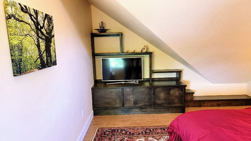 Upstairs is a great place to watch a movie.