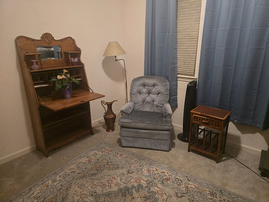 Second separate room with 40 inch TV, antique desk, shelving, table and chairs. May be office or living room.