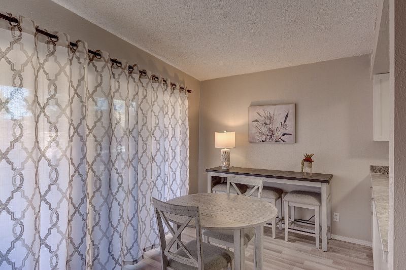 Dining area has sliding glass doors that open to your own patio
