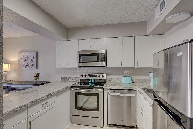 Now there is a full size refrigerator in the kitchen