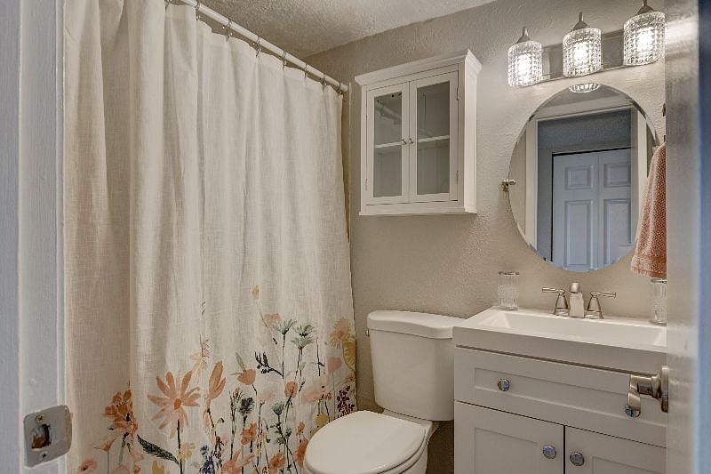 This guest bath has a shower tub