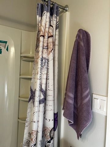 Full length shower with curtain