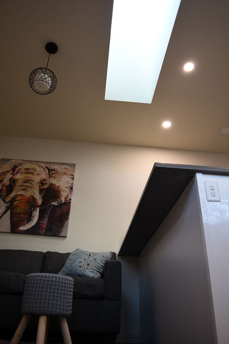 Skylight in the kitchen/living space, windows throughout, and open floor plan living