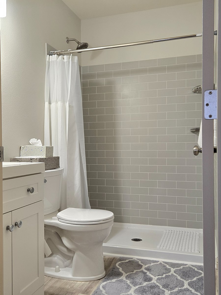 Each bedroom includes a private bathroom (with new sink vanities, toilets, and showers), 58" flat screen Smart TV, and a desk and office chair.