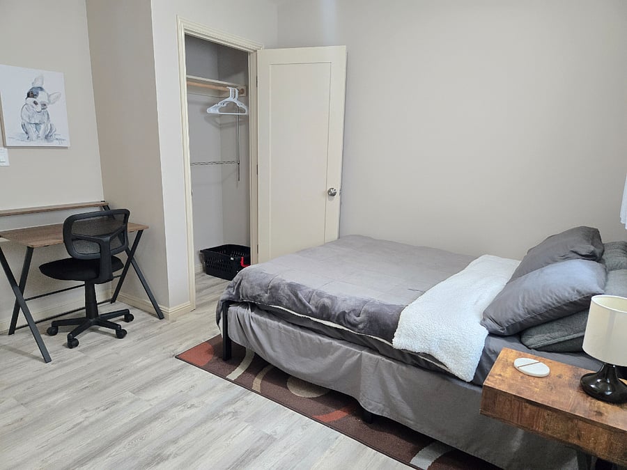 Each bedroom includes a private bathroom (with new sink vanities, toilets, and showers), 58" flat screen Smart TV, and a desk and office chair.
