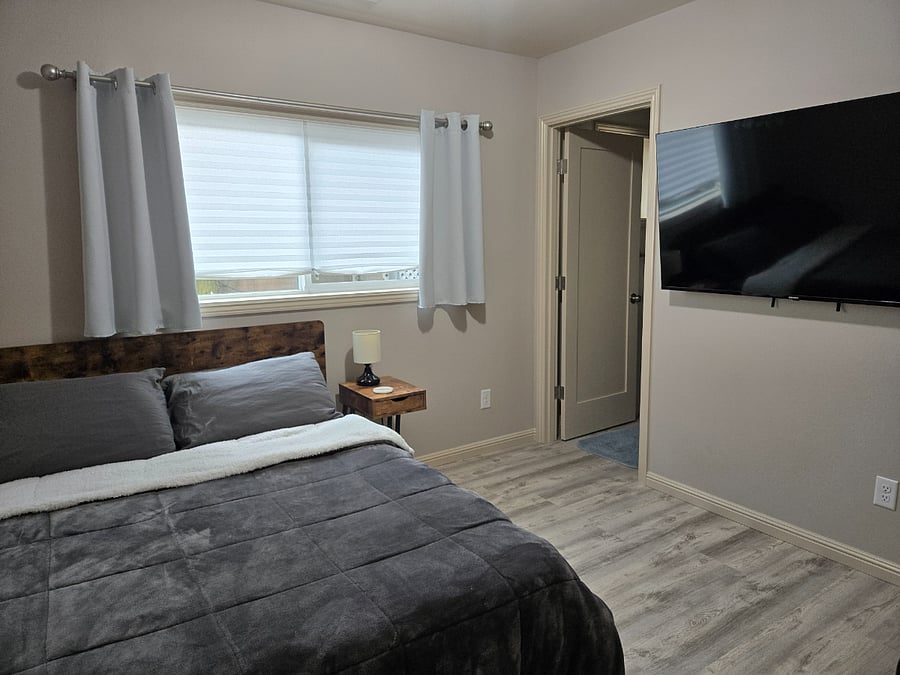 Each bedroom includes a private bathroom (with new sink vanities, toilets, and showers), 58" flat screen Smart TV, and a desk and office chair.
