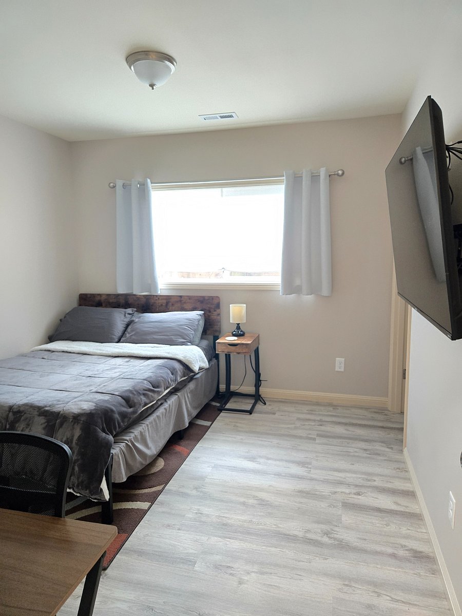 Each bedroom includes a private bathroom (with new sink vanities, toilets, and showers), 58" flat screen Smart TV, and a desk and office chair.
