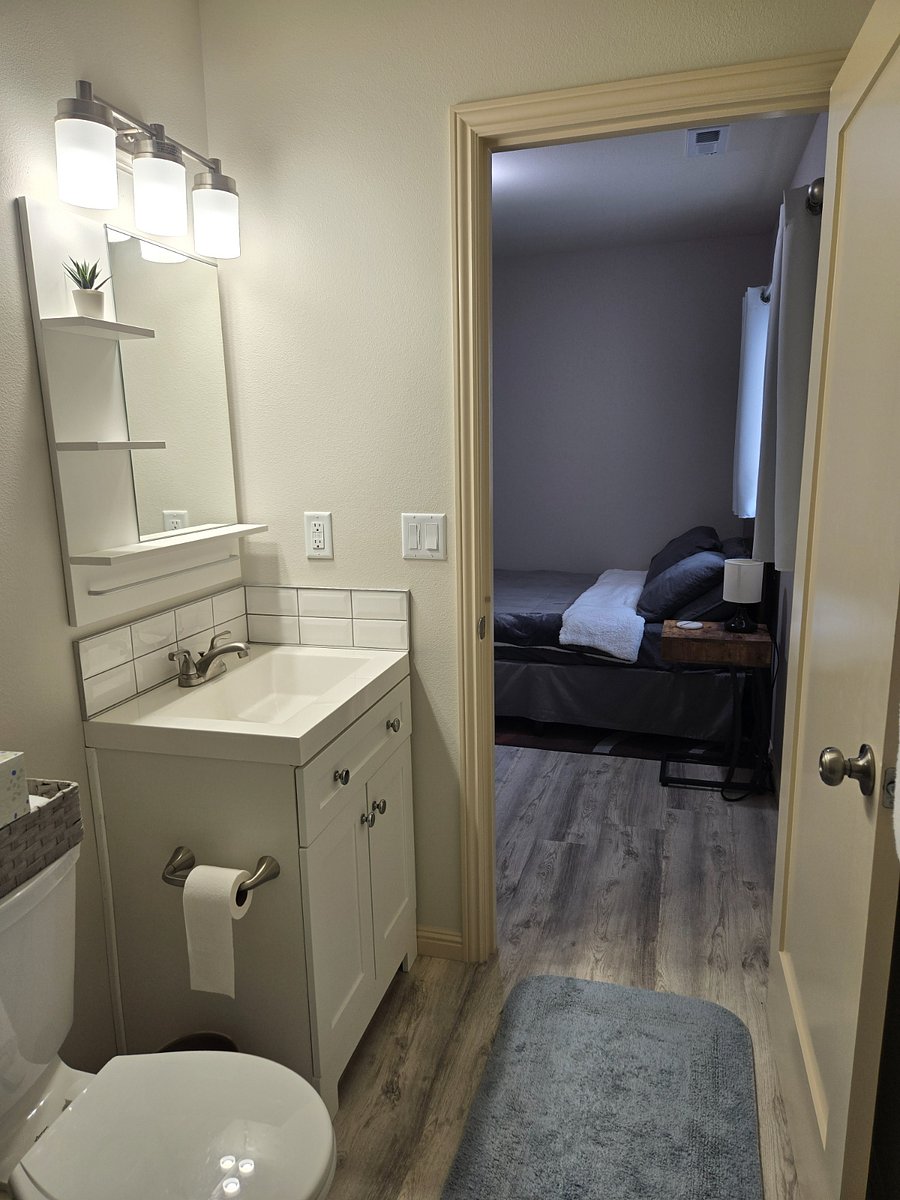 Each bedroom includes a private bathroom (with new sink vanities, toilets, and showers), 58" flat screen Smart TV, and a desk and office chair.