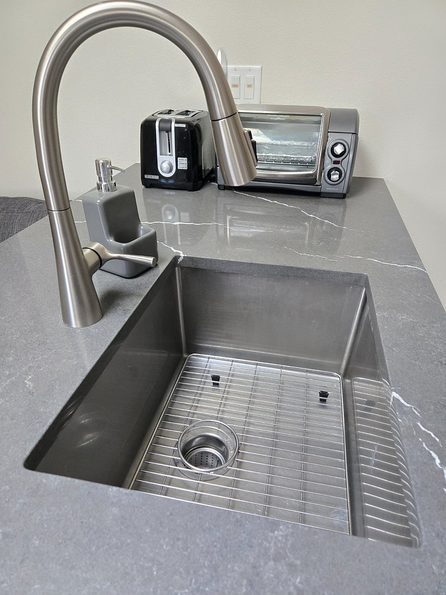 New quartz countertops and new cabinets. Stainless steel sink and dishwasher 
