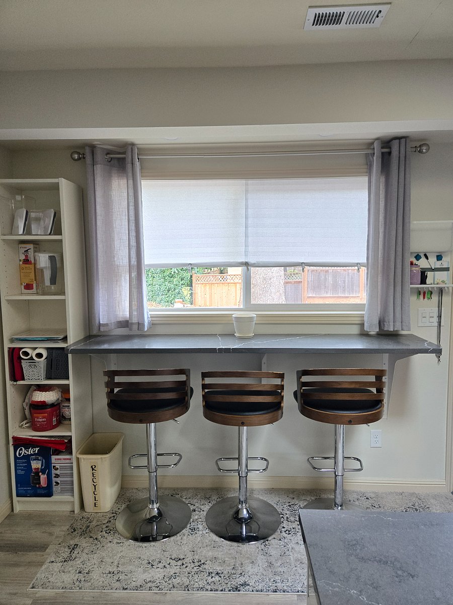 Custom window bar with views of the spacious and private backyard (1/3 acre lot size)