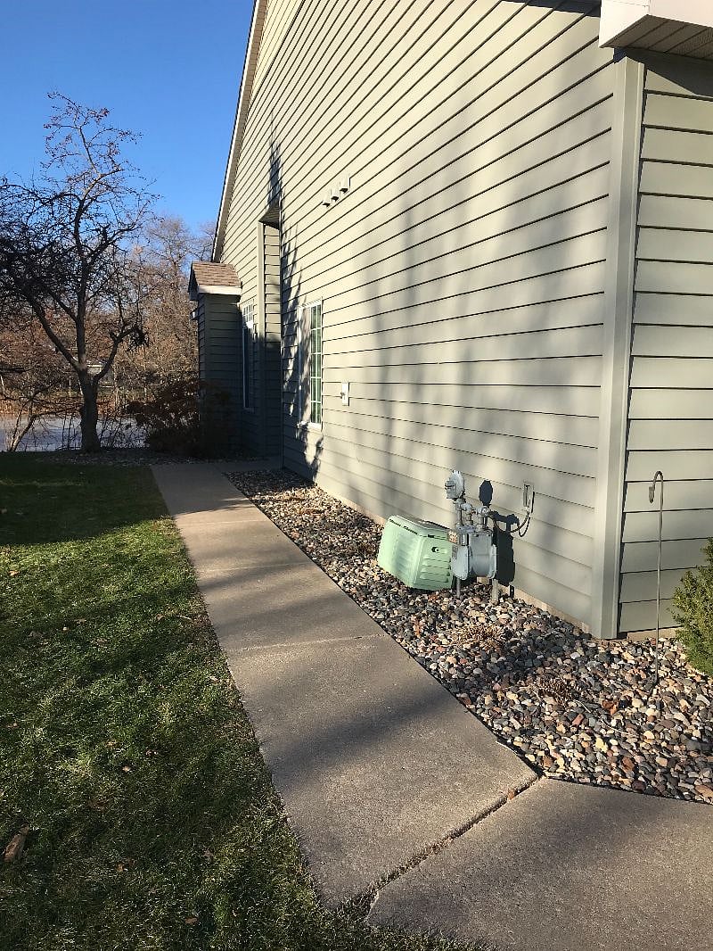 Sidewalk to front door, which is actually on the side