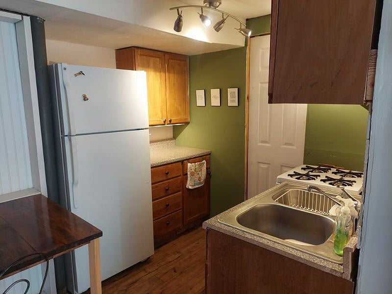 The white door here lead to the laundry, workout room and rest of house. Also pictured here is fold out table.