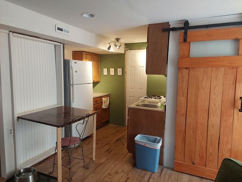 Kitchen comes with full size fridge and several cabinets. We have stocked with some pots, pans, plates, bowls, flatware, etc, but there is still room if you have items you want to bring too.