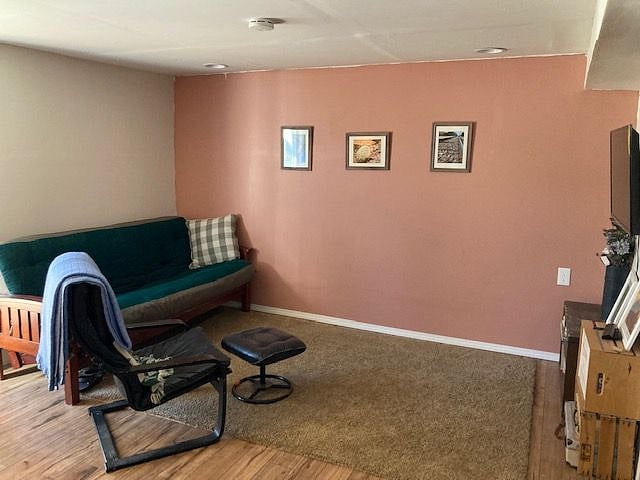 Living room, main entrance to apartment is just off the picture to the left. It's a private entrance and parking is just outside your door.