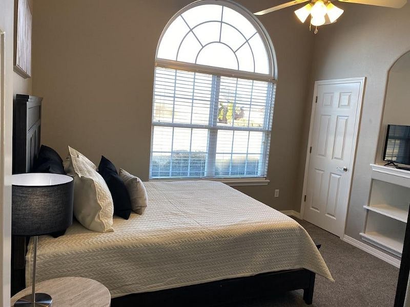 Room offers queen bed, 36" LED/Smart TV and closet space.