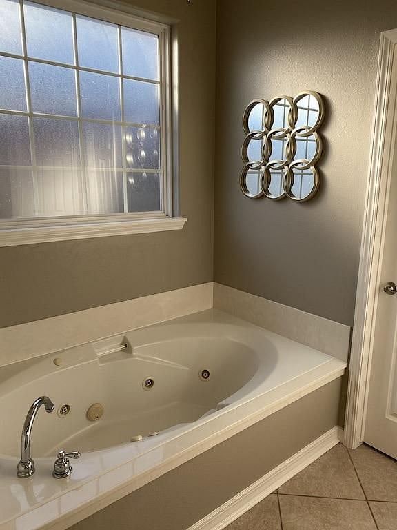 Master bathroom has a jetted bathtub.