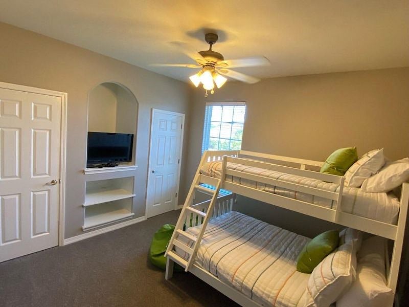 Bedroom has bunk beds, 36" LED/Smart TV and ceiling fan.