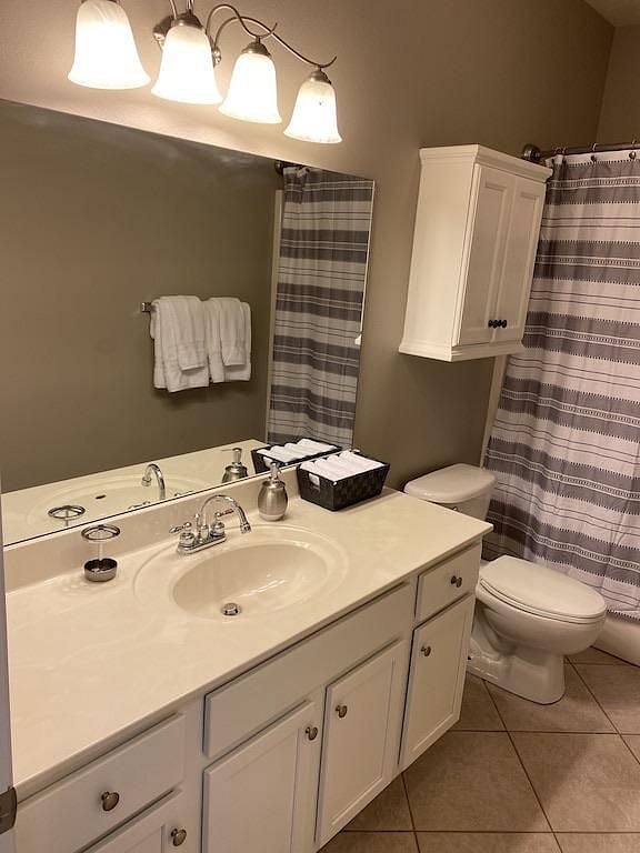 Bathroom offers sink, full size bathtub, hair dryer and toilet.