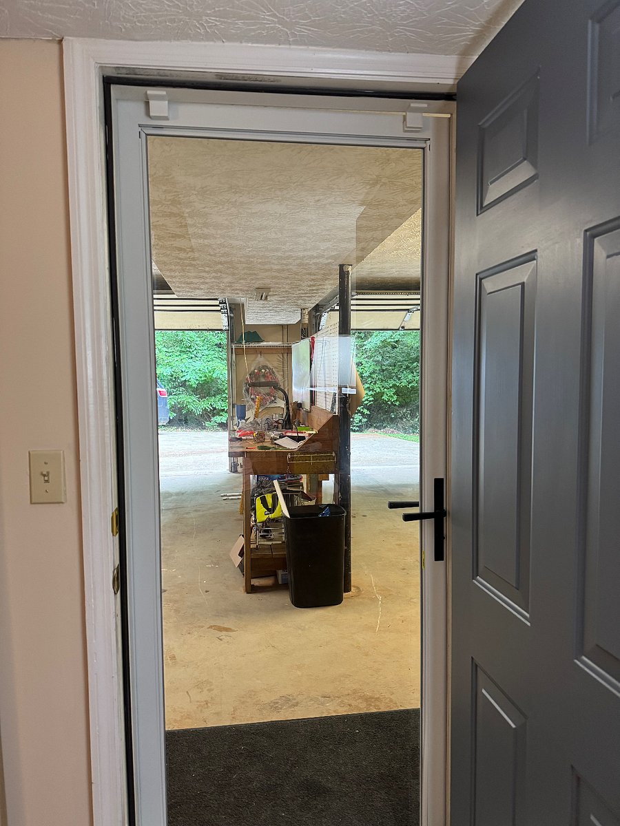 Heres a view of the entrance opened with the storm door in place so you can get natural light during the day.
