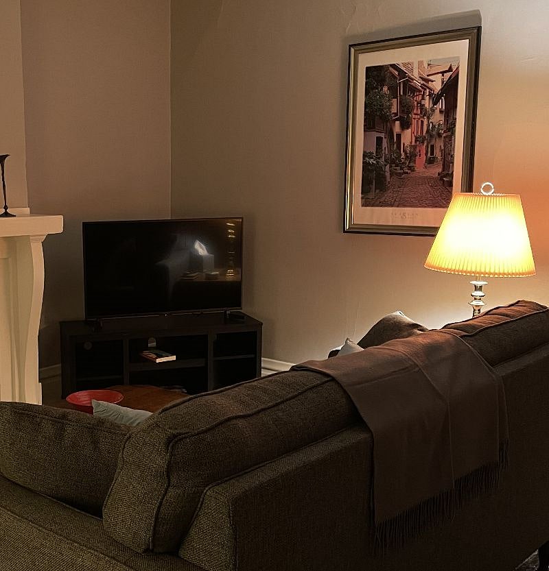 The fireplace and television share your view from the couch