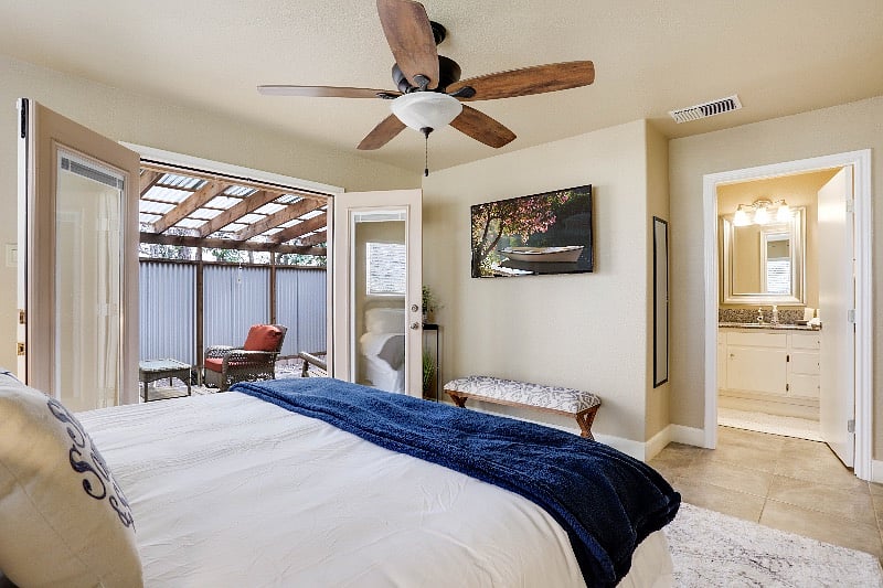 Comfortable King Master Ensuite with private covered patio and Smart TV.