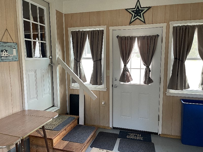 Main entrance in breezeway. A couple of steps to enter house.
