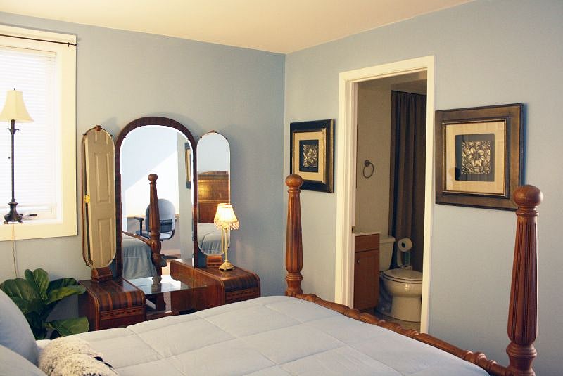 The bathroom is just off the bedroom.