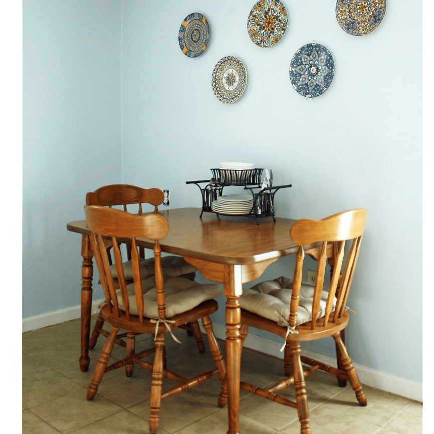 Dining table and chairs, with dishware and cutlery for 4.