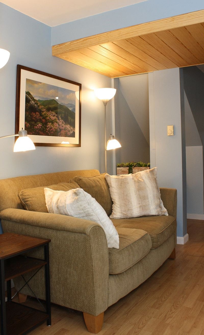 The loveseat nook with super soft pillows, endtables, and reading lamps.