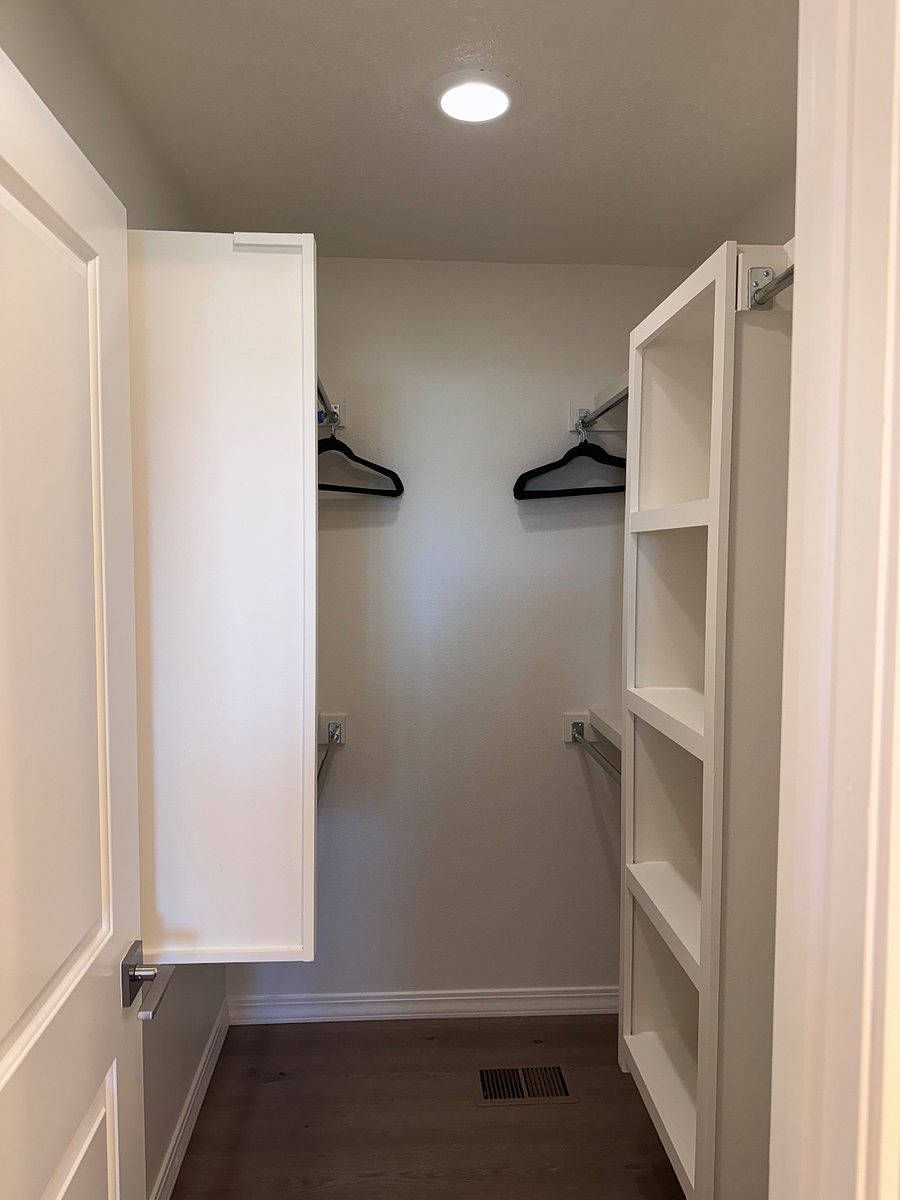 Primary bedroom walk in closet