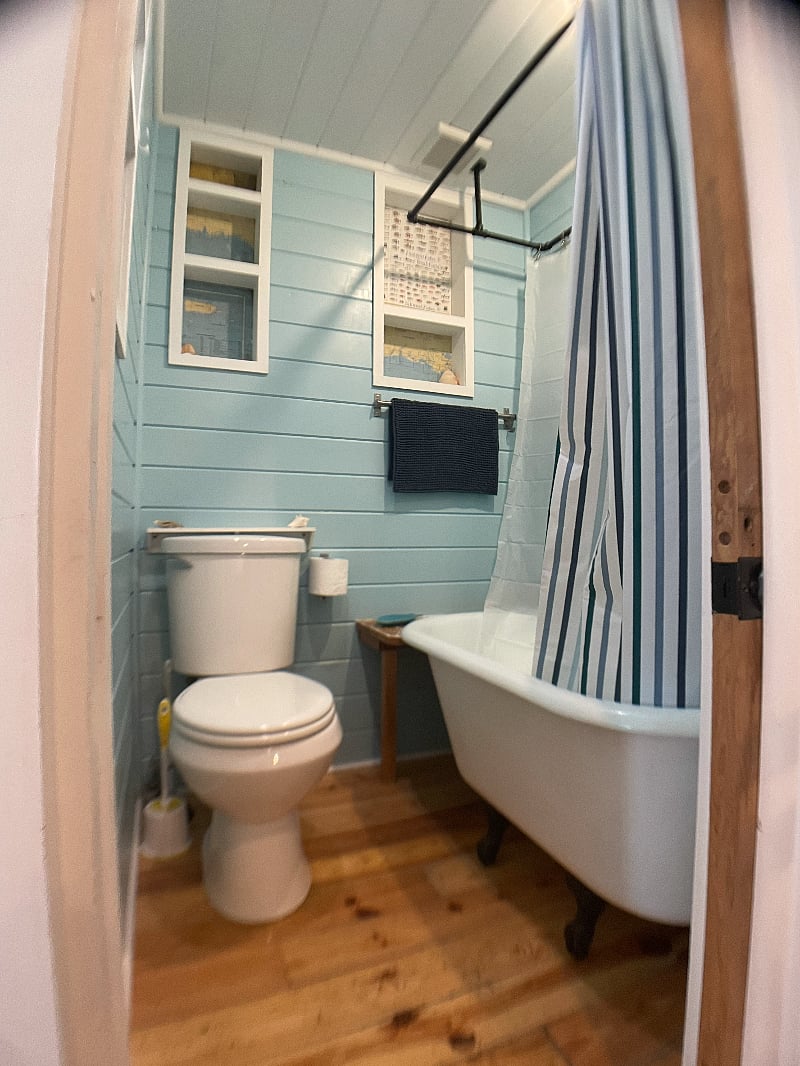 Cute little claw foot tub and shower.